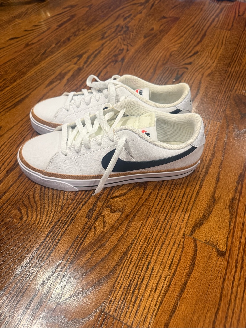 Nike Womens White Low-Top Sneakers with Black Swoosh and Tan Trim